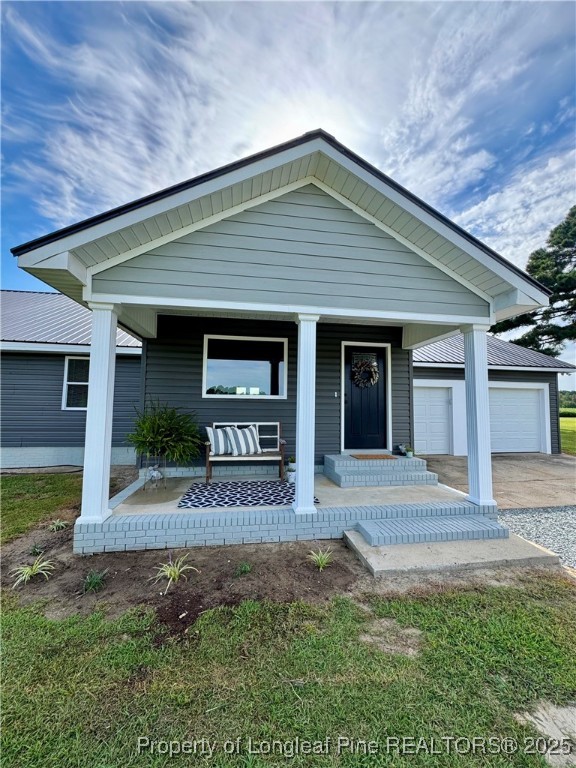 1283 Bethel Baptist Road Spring Lake, NC 28390 - Photo 35 of 44 a front view of a house with garden