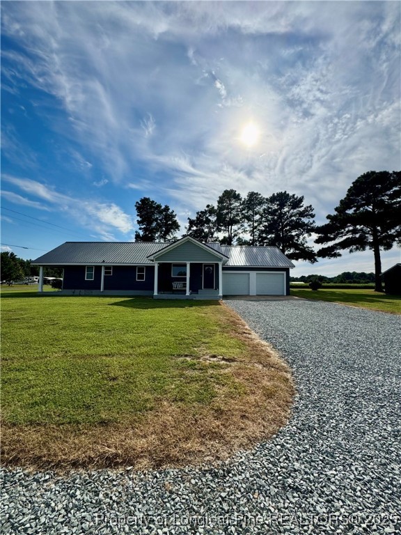 1283 Bethel Baptist Road Spring Lake, NC 28390 - Photo 38 of 44 a view of a house with a yard