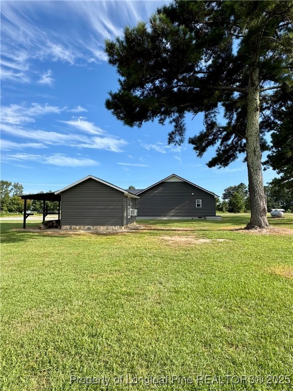 1283 Bethel Baptist Road Spring Lake, NC 28390 - Photo 39 of 44 a view of a house with a yard