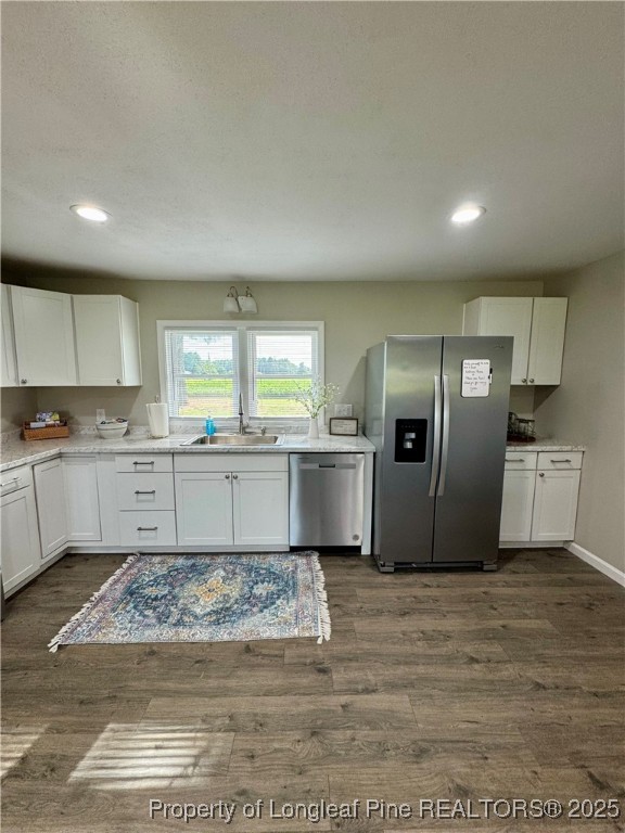 1283 Bethel Baptist Road Spring Lake, NC 28390 - Photo 4 of 44 a large kitchen with kitchen island a sink stainless steel appliances and cabinets