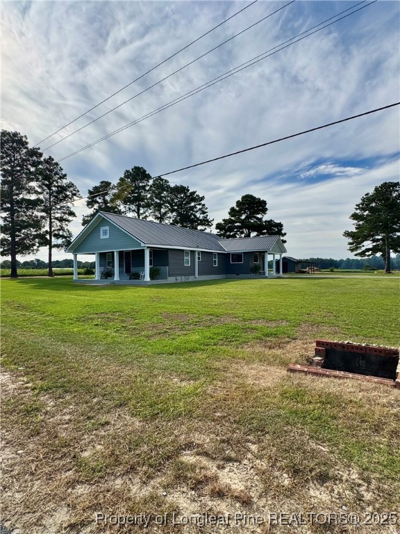 1283 Bethel Baptist Road Spring Lake, NC 28390 - Photo 41 of 44 a view of a house with a yard