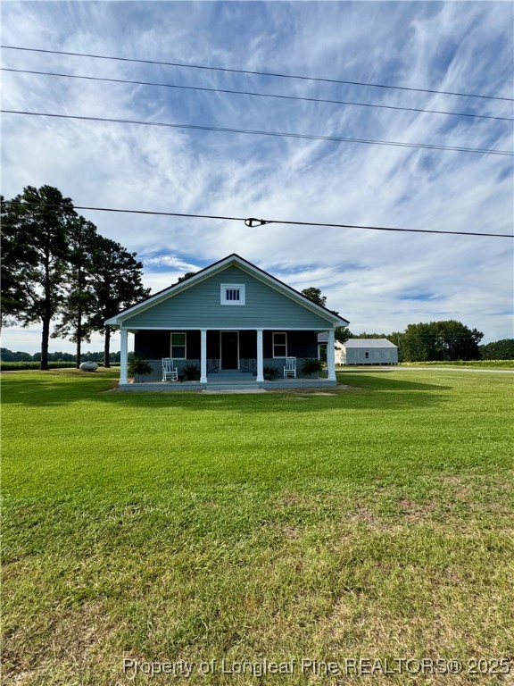 1283 Bethel Baptist Road Spring Lake, NC 28390 - Photo 42 of 44 a front view of a house with garden