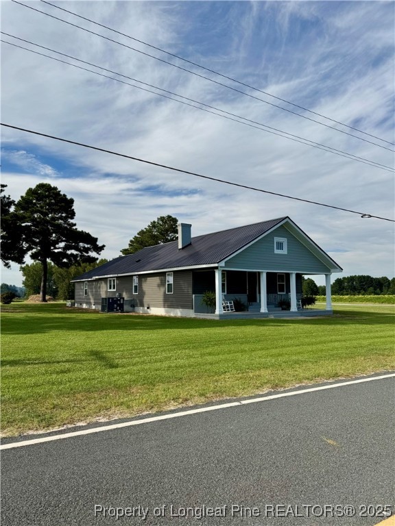 1283 Bethel Baptist Road Spring Lake, NC 28390 - Photo 43 of 44 a front view of a house with a garden