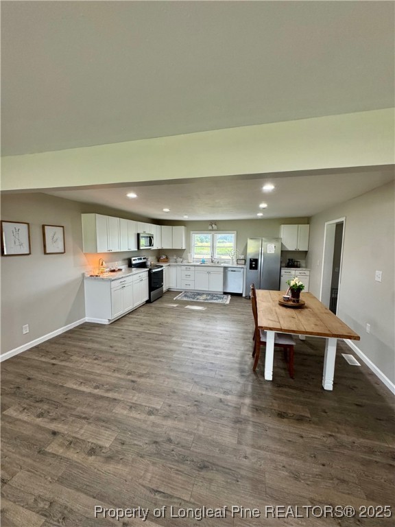 1283 Bethel Baptist Road Spring Lake, NC 28390 - Photo 6 of 44 a living room with furniture and a table