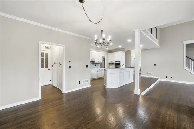 a view of a kitchen with wooden floor