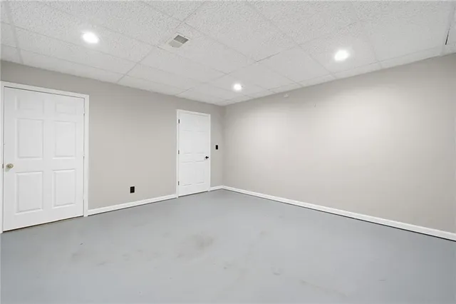 a view of a room with wooden walls