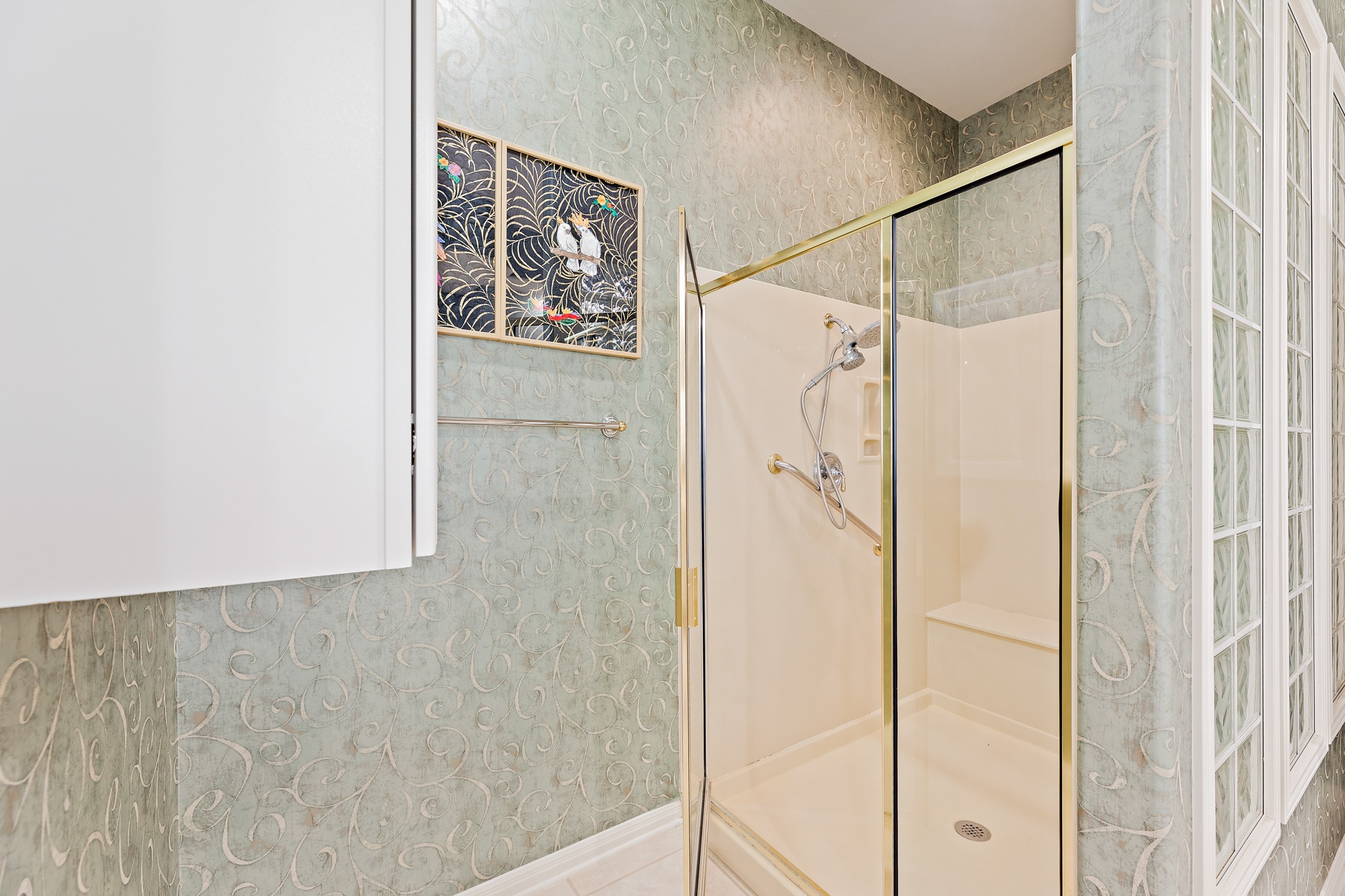 106 Wild Turkey Lane Georgetown, TX 78633 - Photo 28 of 39 a bathroom with a shower and a glass door