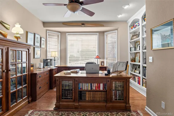 a dining room with furniture and a window