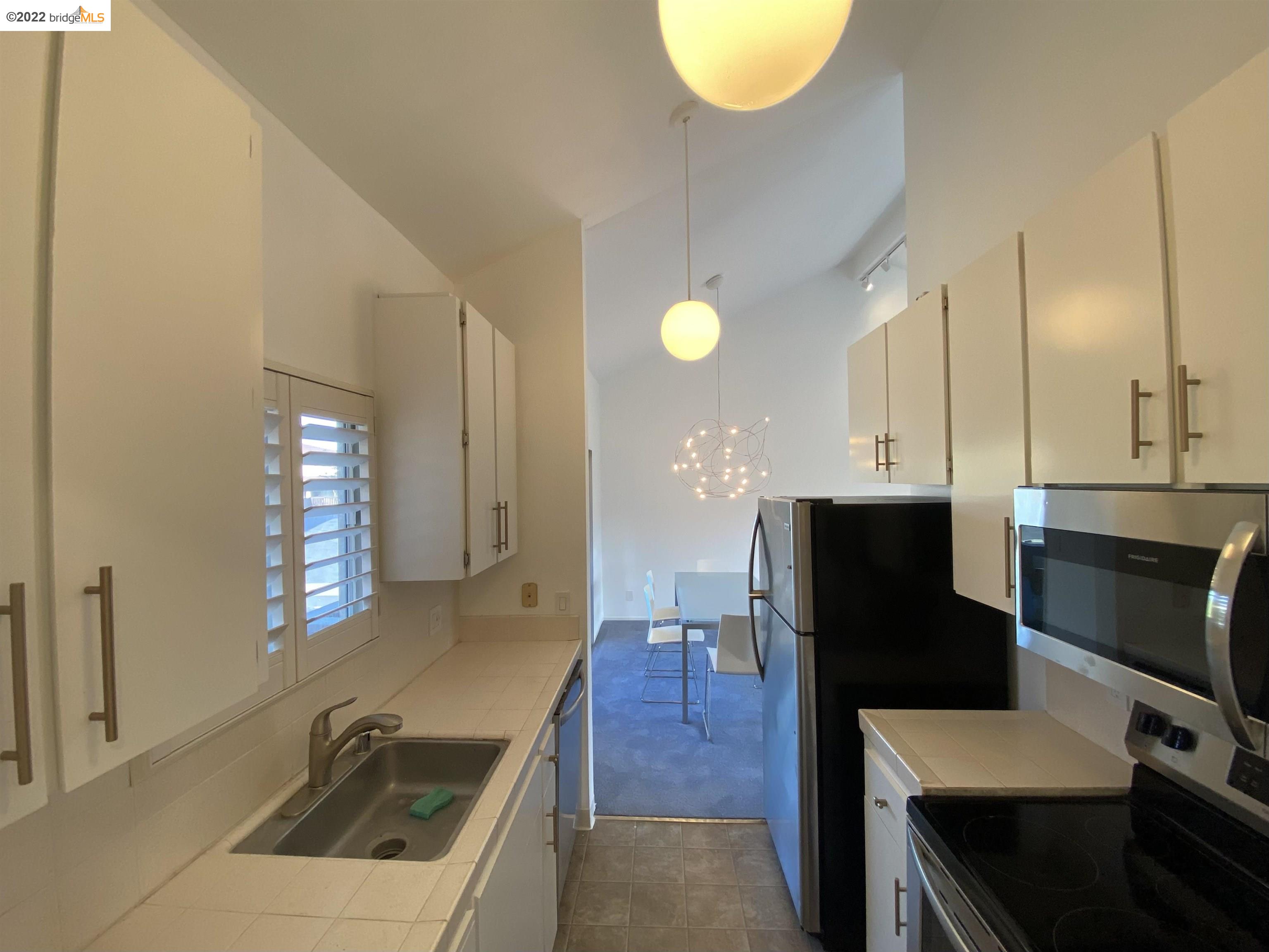 1996 Ascot Drive, Unit C Moraga, CA 94556 - Photo 5 of 6 a view of a kitchen with a sink