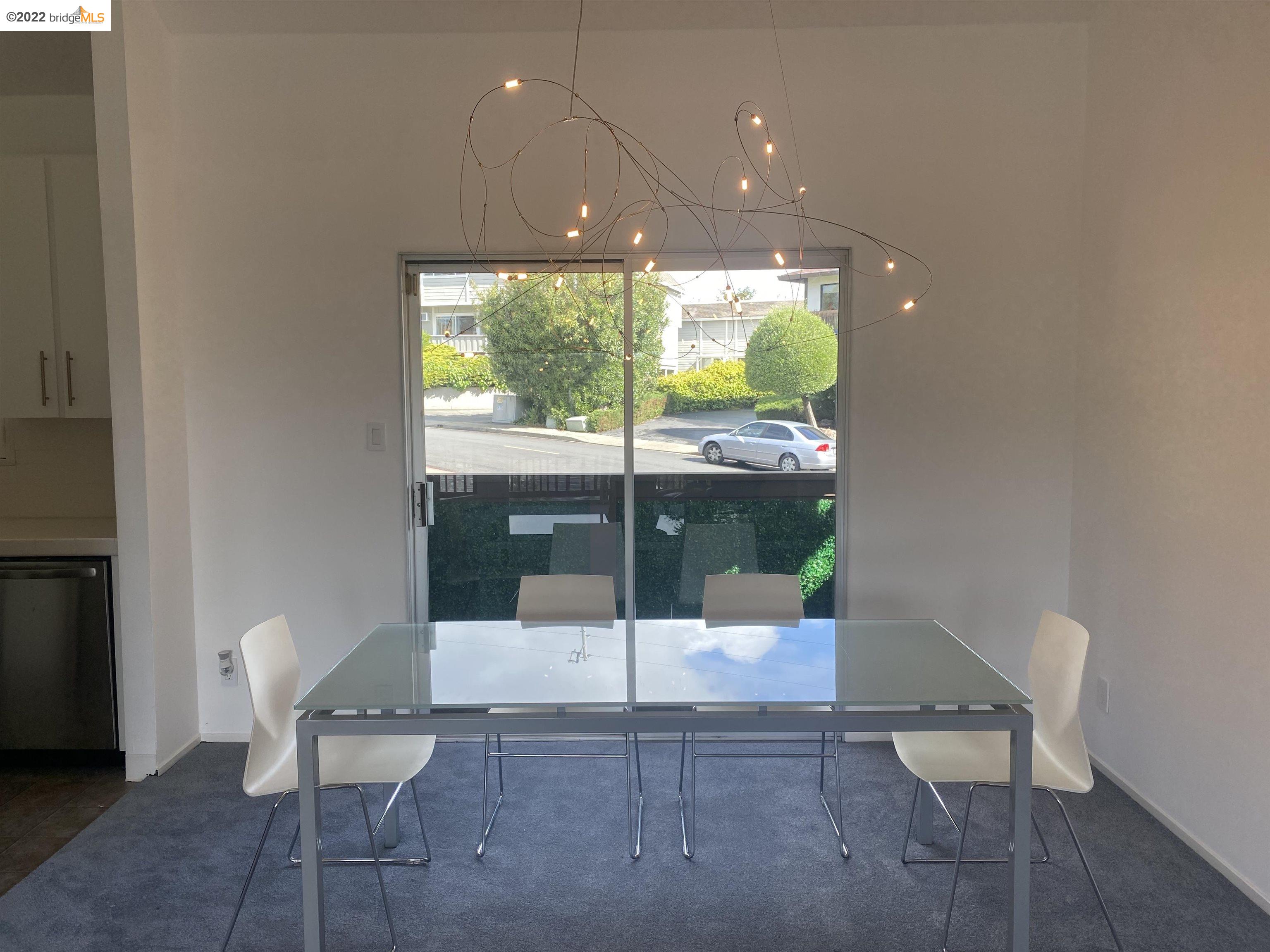 1996 Ascot Drive, Unit C Moraga, CA 94556 - Photo 6 of 6 a room with a chair and potted plant