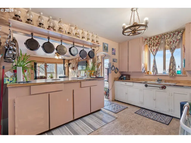 a view of entryway with furniture and a chandelier