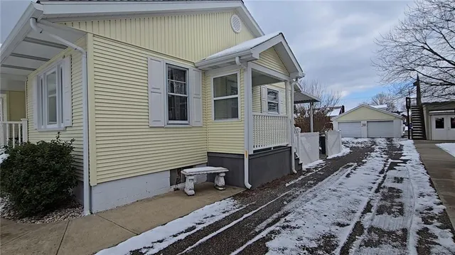 a front view of a house with many windows
