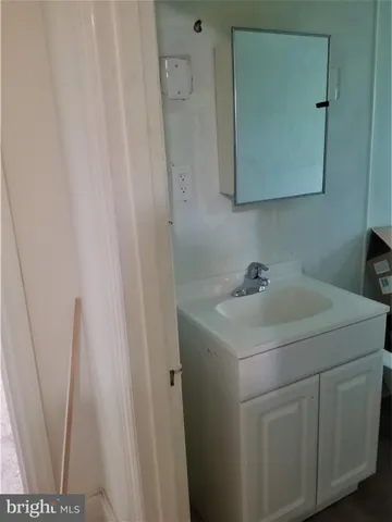 a bathroom with a sink and vanity
