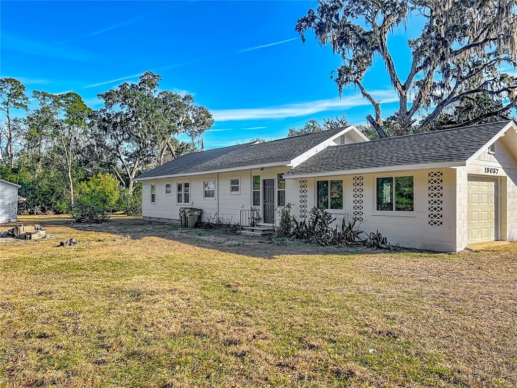 a view of a house with swimming pool