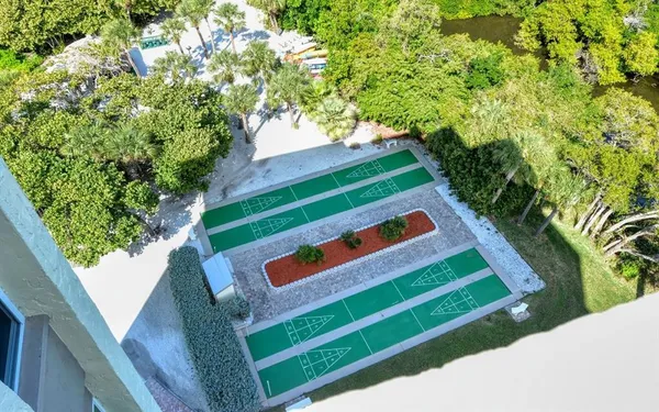 a view of a swimming pool with a yard