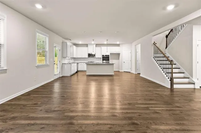 a view of kitchen and dining room with wooden floor