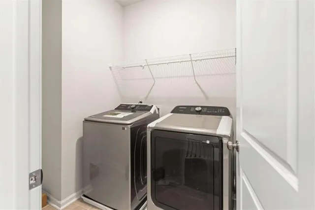 a utility room with dryer and washer