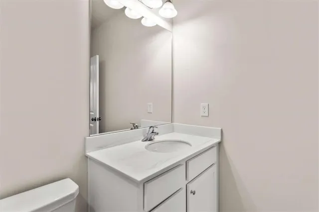 a bathroom with a sink vanity and a mirror