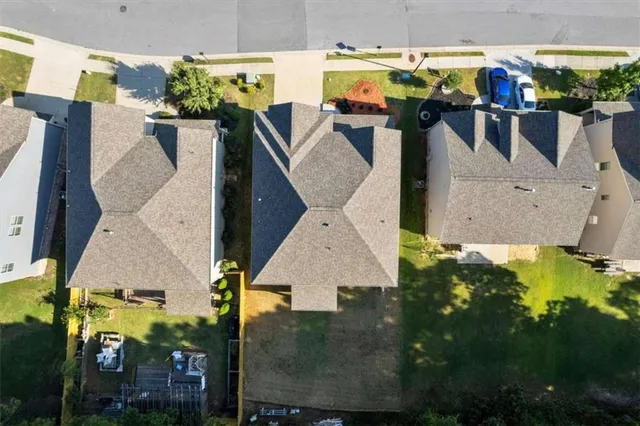 an aerial view of houses with outdoor space