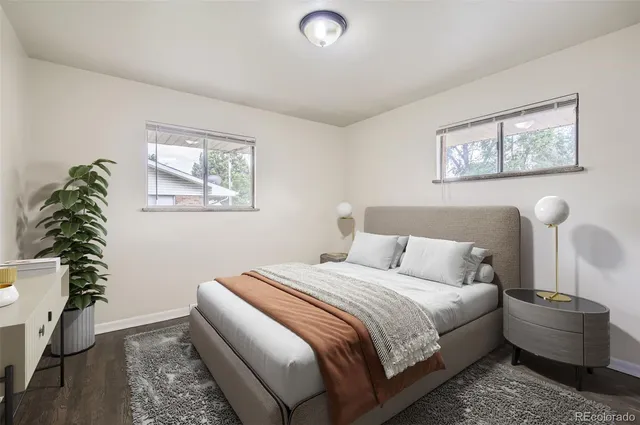 a view of a room with wooden floor and window