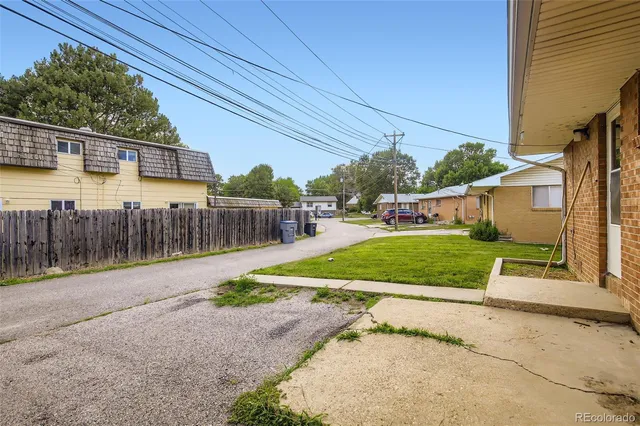 a view of a swimming pool with an outdoor space and seating area