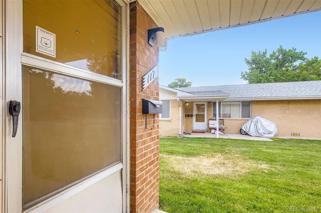 a living room with furniture wooden floor and a window