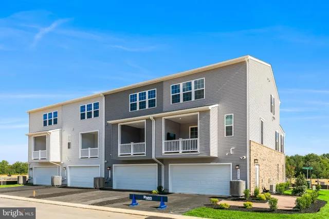 a front view of a building with street view