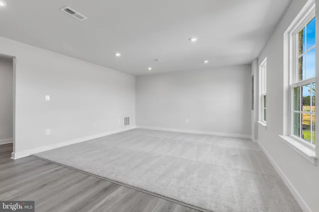 an empty room with windows