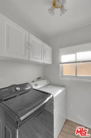 a bedroom with a bed and a television