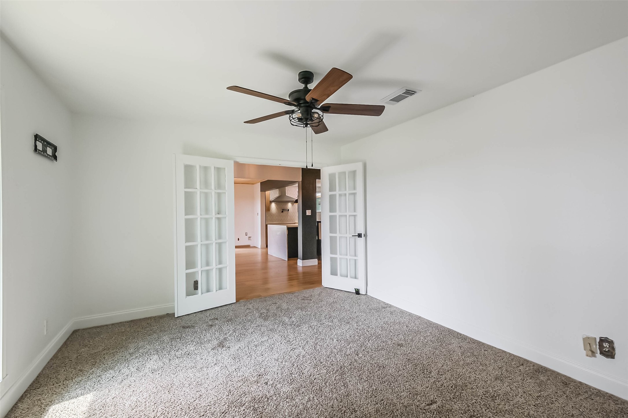 11019 Clodine Road Sugar Land, TX 77498 - Photo 7 of 39 a view of a livingroom with a ceiling fan and a chandelier fan