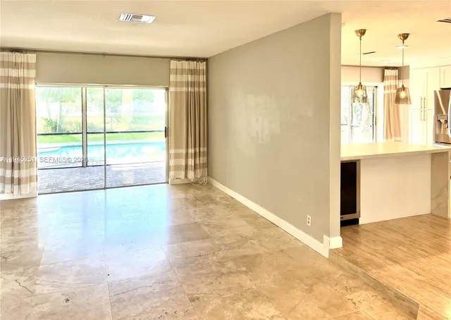 a view of an empty room and window