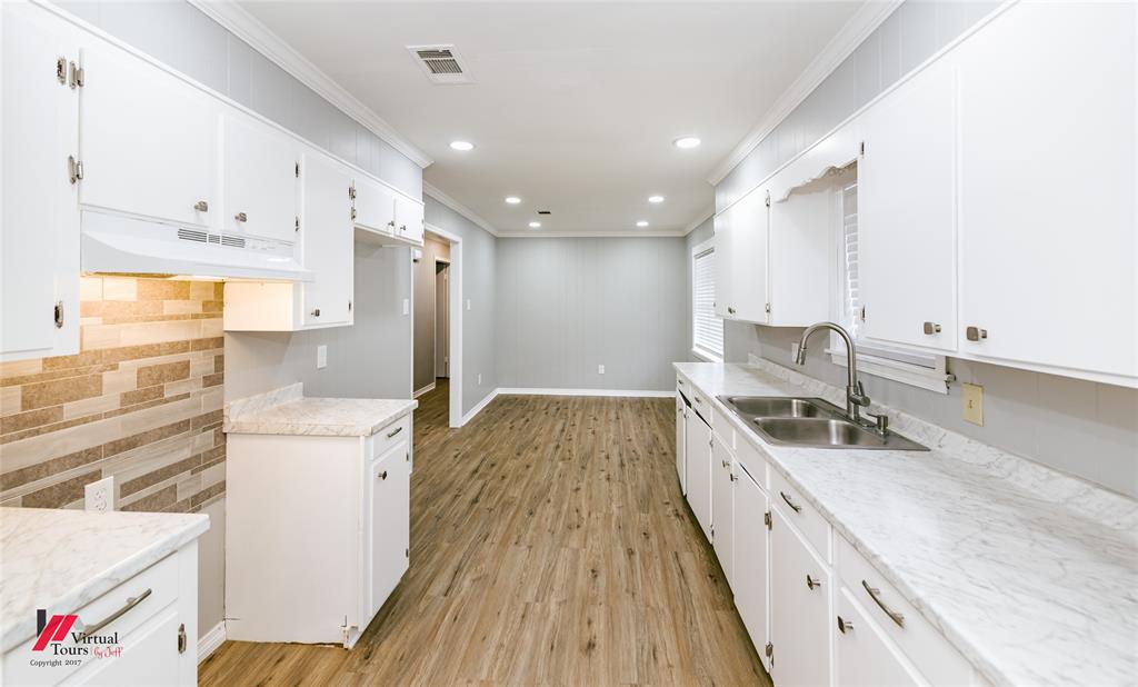 2036 Abney Street Coushatta, LA 71019 - Photo 11 of 32 a kitchen with a sink a stove a refrigerator and a cabinets