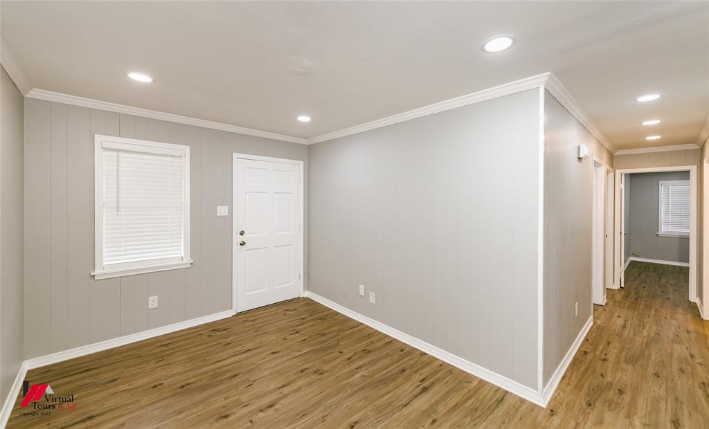 2036 Abney Street Coushatta, LA 71019 - Photo 4 of 32 a view of an empty room with wooden floor and a window