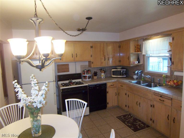 10212 Biddulph Road Cleveland, OH 44144 - Photo 11 of 20 Eat-in kitchen with plenty of cabinets and counter space. There is a pantry just outside the kitchen.
