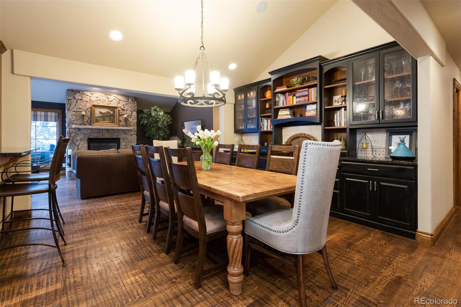 497 Meadow Vista Drive Evergreen, CO 80439 - Photo 11 of 40 a view of a dining room with furniture