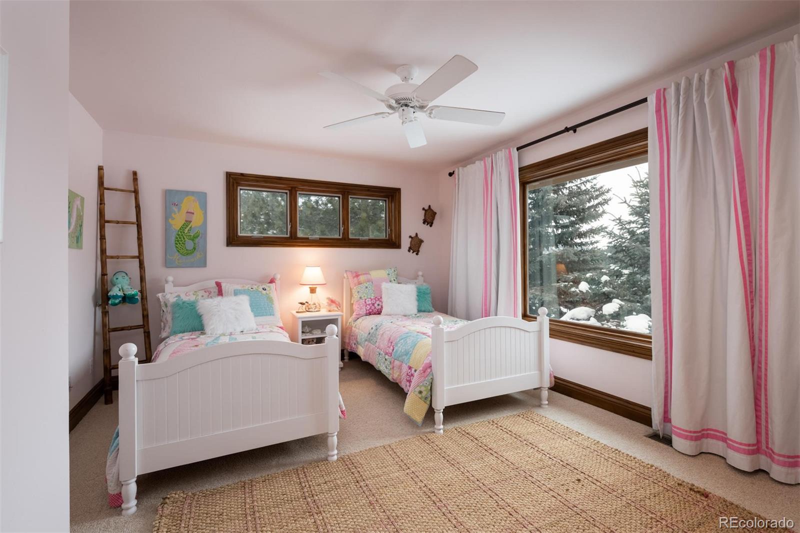 497 Meadow Vista Drive Evergreen, CO 80439 - Photo 24 of 40 a bedroom with bed and window