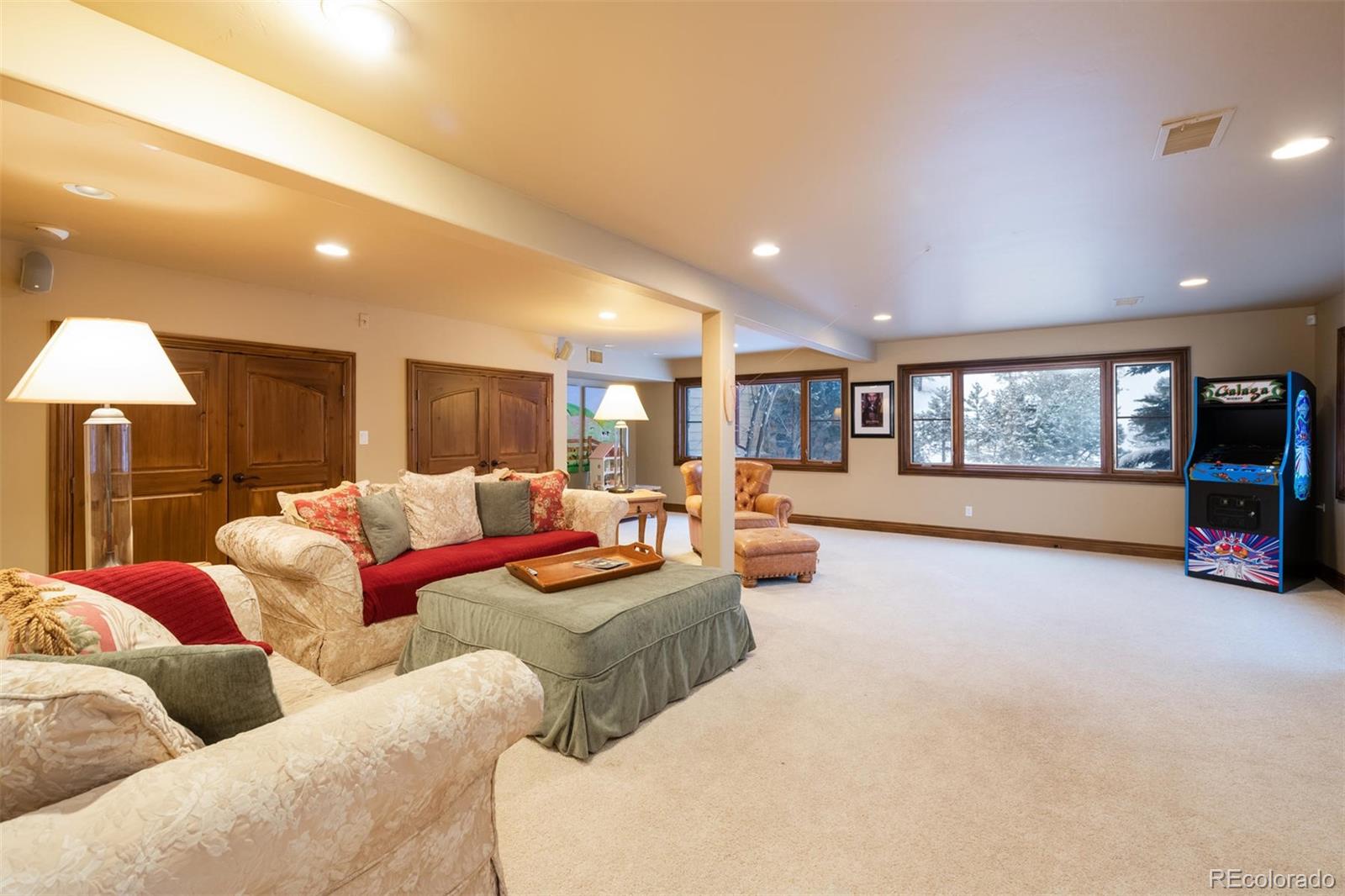 497 Meadow Vista Drive Evergreen, CO 80439 - Photo 27 of 40 a living room with furniture and a wooden floor