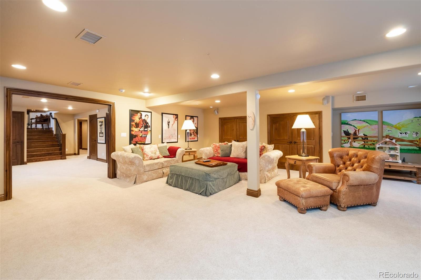 497 Meadow Vista Drive Evergreen, CO 80439 - Photo 28 of 40 a living room with furniture and a large window