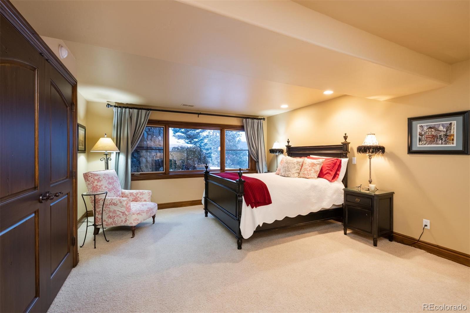 497 Meadow Vista Drive Evergreen, CO 80439 - Photo 29 of 40 a bed room with a bed and a large window