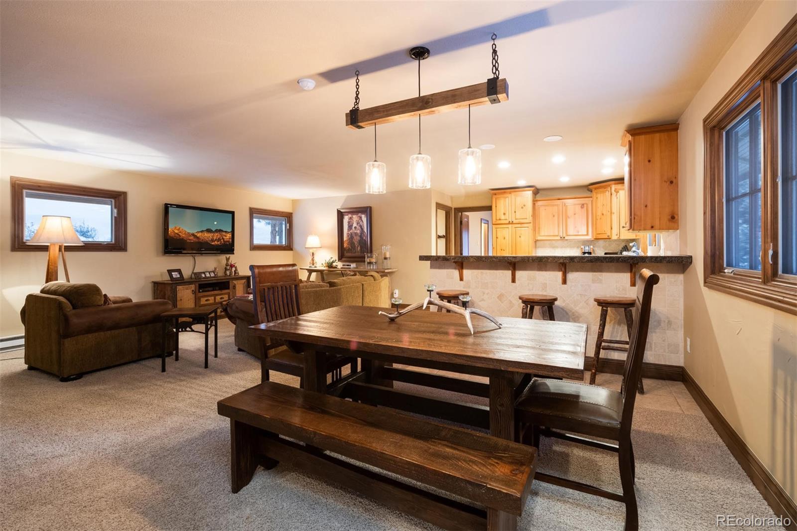 497 Meadow Vista Drive Evergreen, CO 80439 - Photo 33 of 40 a view of a dining room with furniture