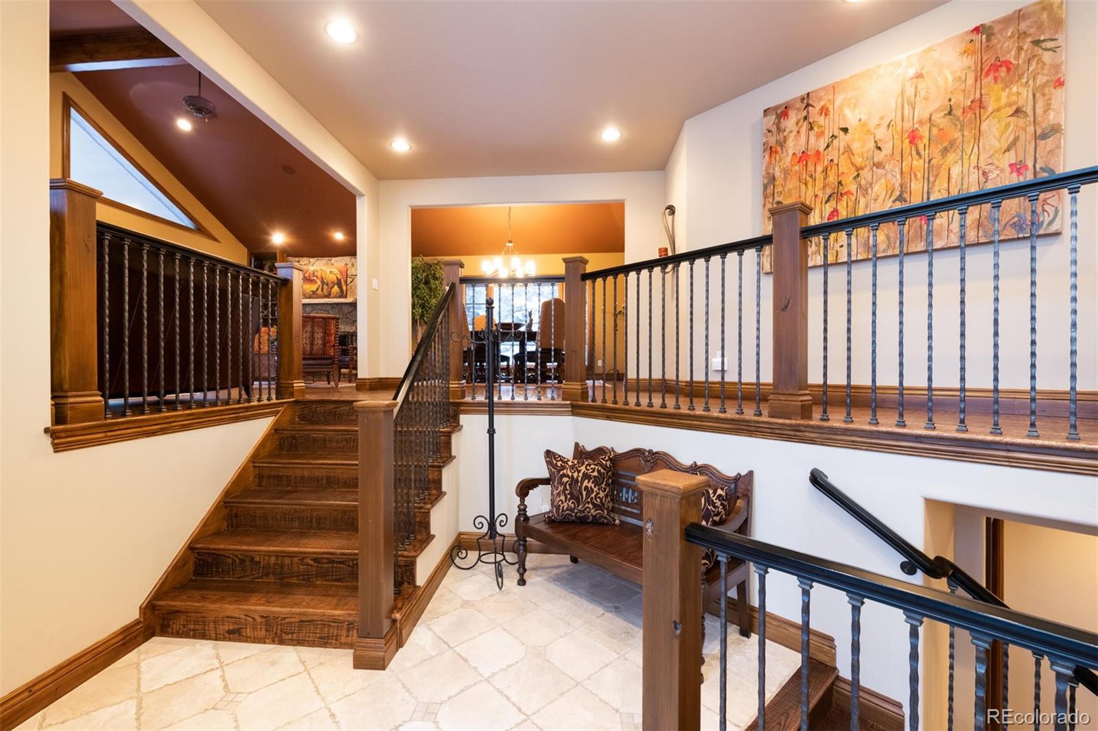 497 Meadow Vista Drive Evergreen, CO 80439 - Photo 4 of 40 a very nice looking room with wooden floor and furniture