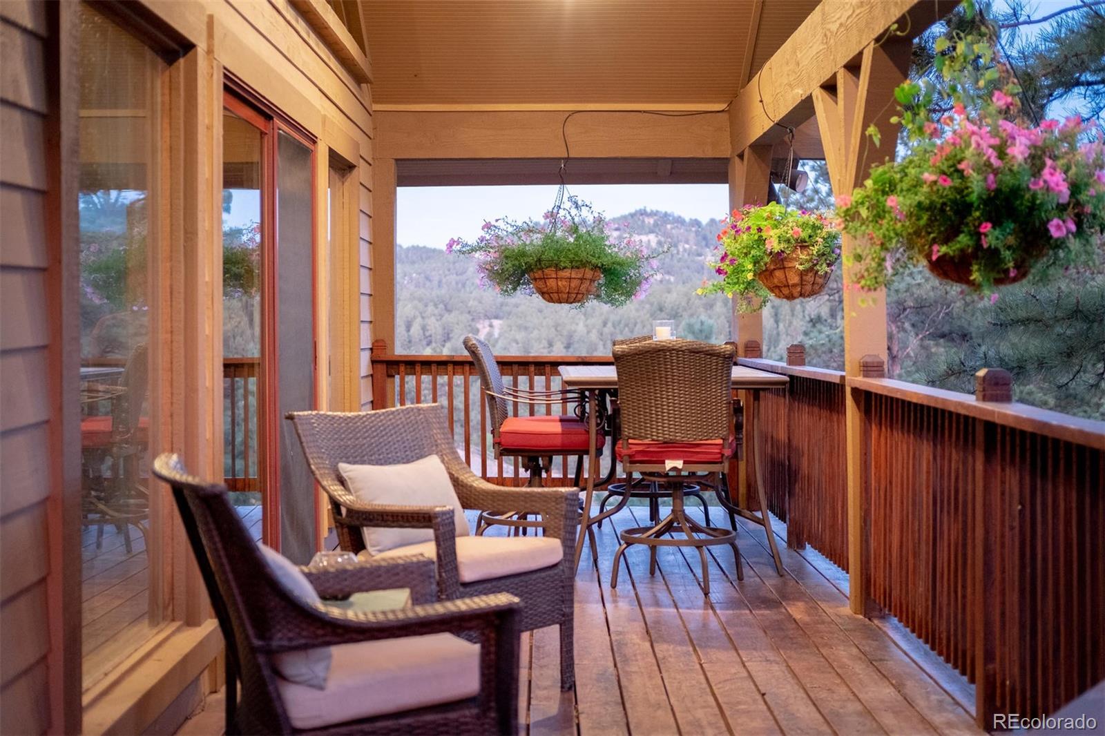 497 Meadow Vista Drive Evergreen, CO 80439 - Photo 7 of 40 a balcony view with a seating space