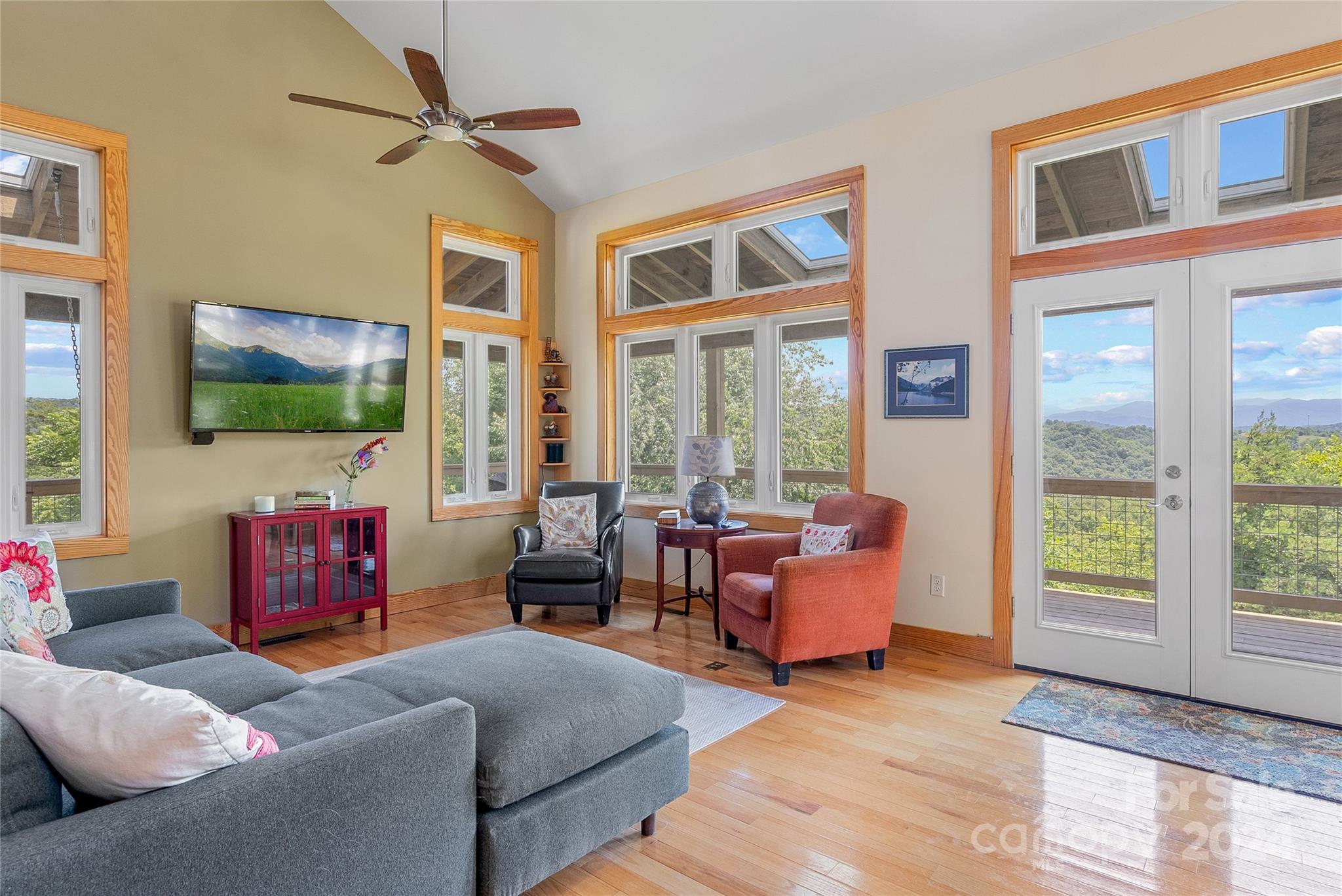 329 Cabin Hollow Drive Marshall, NC 28753 - Photo 11 of 40 a living room with furniture and a flat screen tv