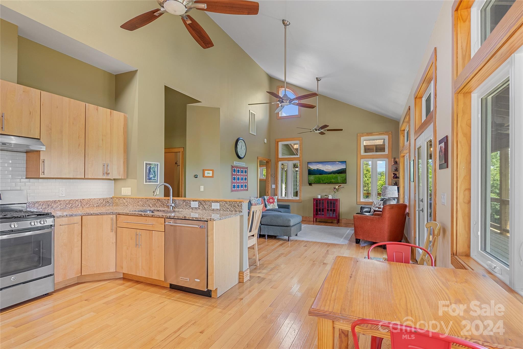 329 Cabin Hollow Drive Marshall, NC 28753 - Photo 13 of 40 a living room with stainless steel appliances granite countertop furniture wooden floor and a view of kitchen