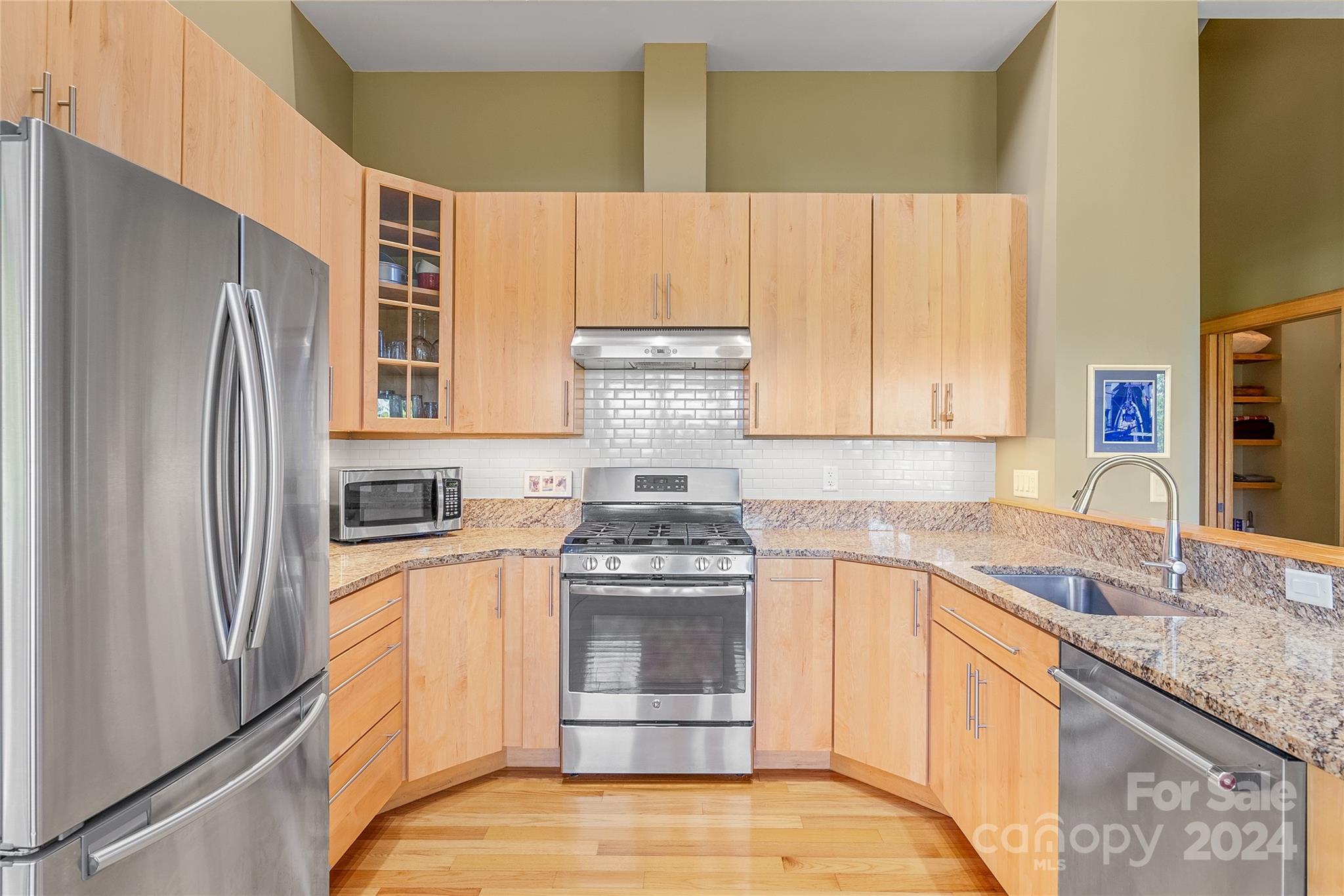 329 Cabin Hollow Drive Marshall, NC 28753 - Photo 14 of 40 a kitchen with stainless steel appliances granite countertop a refrigerator and a sink