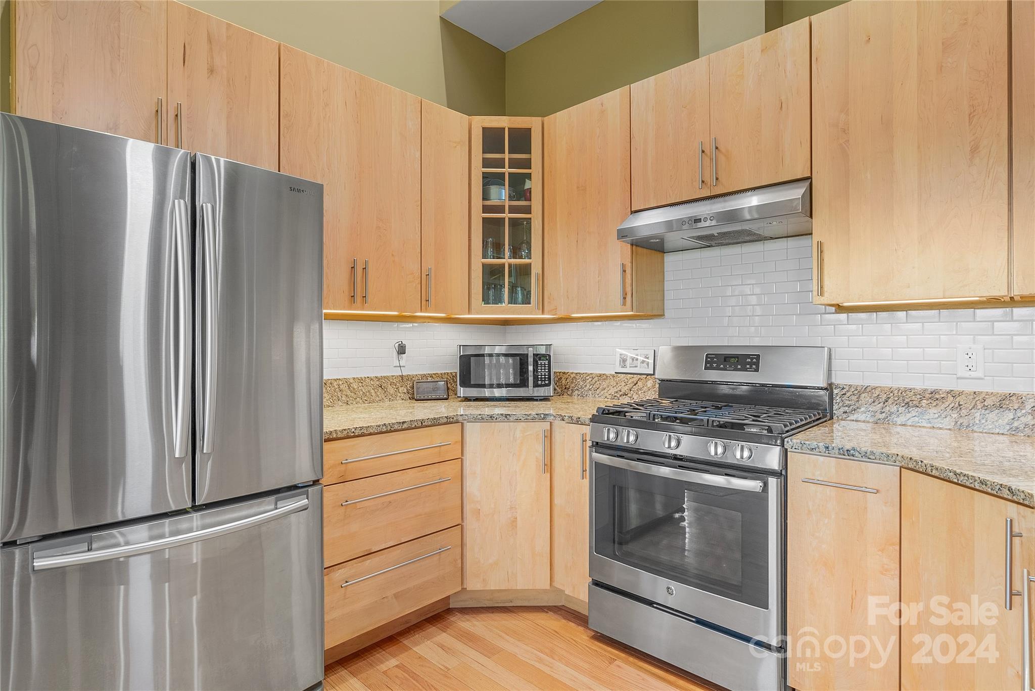 329 Cabin Hollow Drive Marshall, NC 28753 - Photo 16 of 40 a kitchen with stainless steel appliances white cabinets and a refrigerator