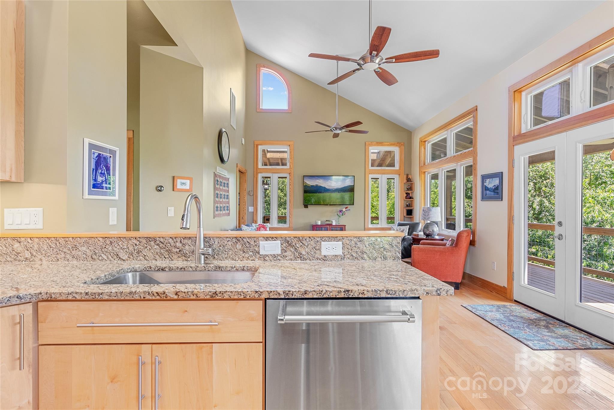 329 Cabin Hollow Drive Marshall, NC 28753 - Photo 17 of 40 a kitchen with stainless steel appliances granite countertop a stove and a sink