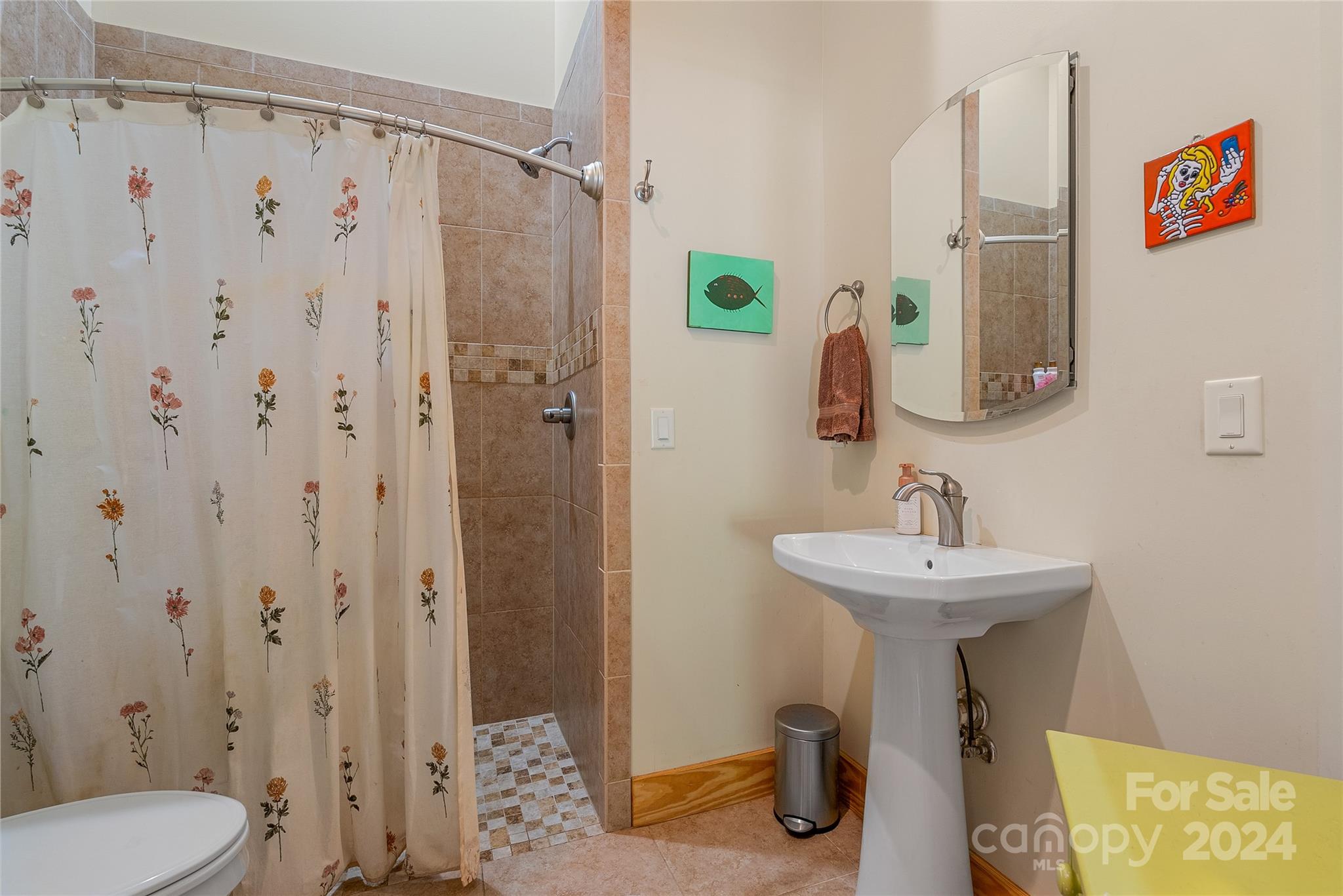 329 Cabin Hollow Drive Marshall, NC 28753 - Photo 26 of 40 a bathroom with a sink a toilet and shower