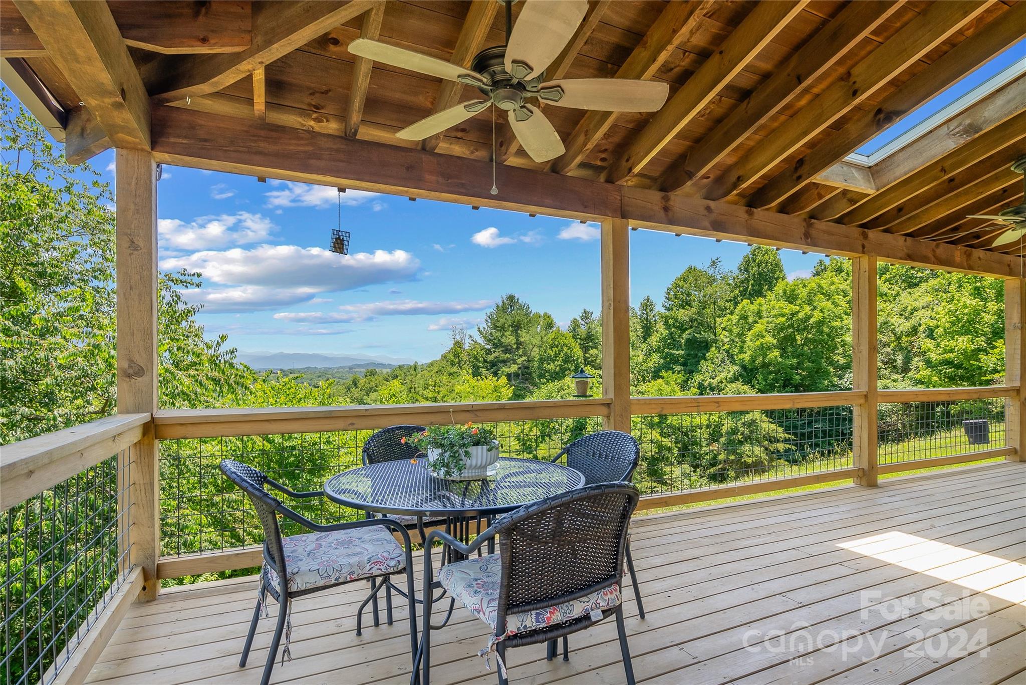 329 Cabin Hollow Drive Marshall, NC 28753 - Photo 29 of 40 a view of a balcony with furniture and wooden floor