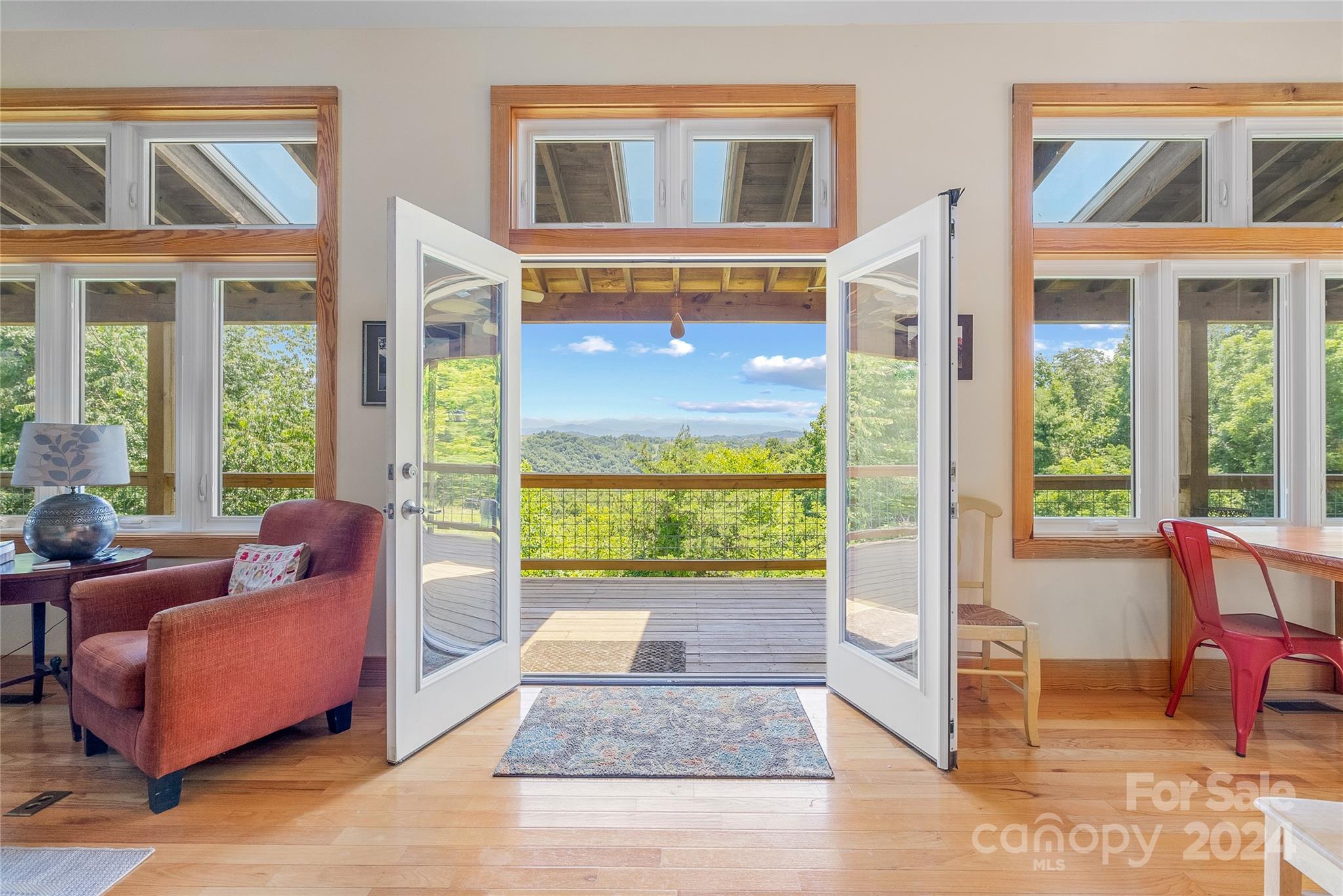 329 Cabin Hollow Drive Marshall, NC 28753 - Photo 3 of 40 a living room filled with furniture and a window
